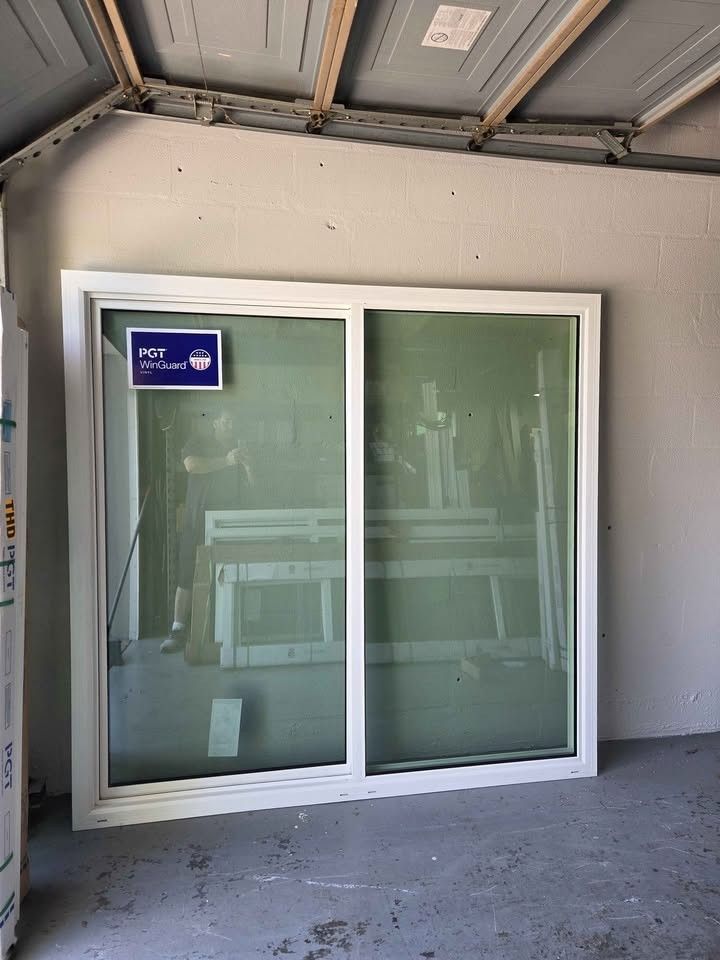 Brand New 61W x 64H PGT WinGuard Impact Sliding Window
