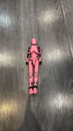 Pink T13 action figure with hands and weapons