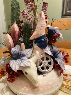 Vintage southwest faux cacti, flowers, coyote and skull in clay adobe house planter pot. Centerpiece