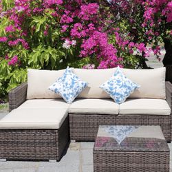 Patio Furniture Set New in Original Packaging With Coffee Table, Cushions and Decorative Cushions.