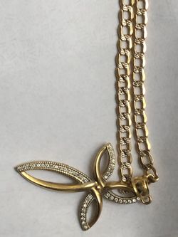 Cuban link 4.5 mm wide Diamond cut 10 karat 26 inch long and the charm is 10 karat