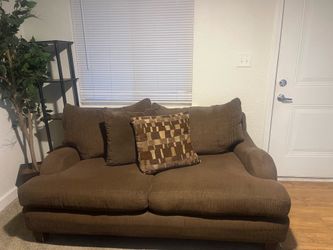 Brown Corduroy-style sofa and love seat with pattern accent pillows