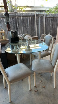 Glass table with 4 chairs