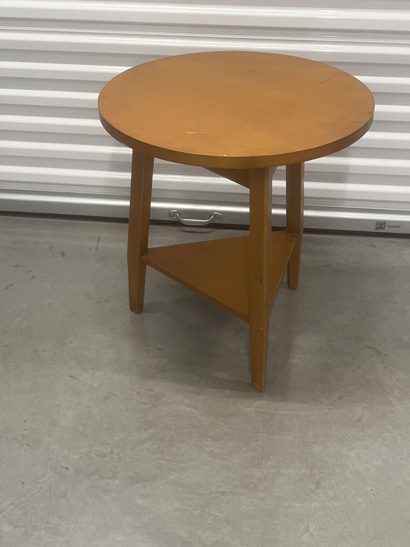 The Modern Lane Round Side Table is a beautifully crafted antique piece with a mid-century modern style. Made in the United States post-1950, this fu