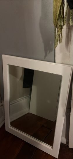 white framed hanging mirror