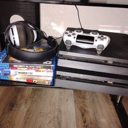 2 PS4 Slims With A White Controller And Headset