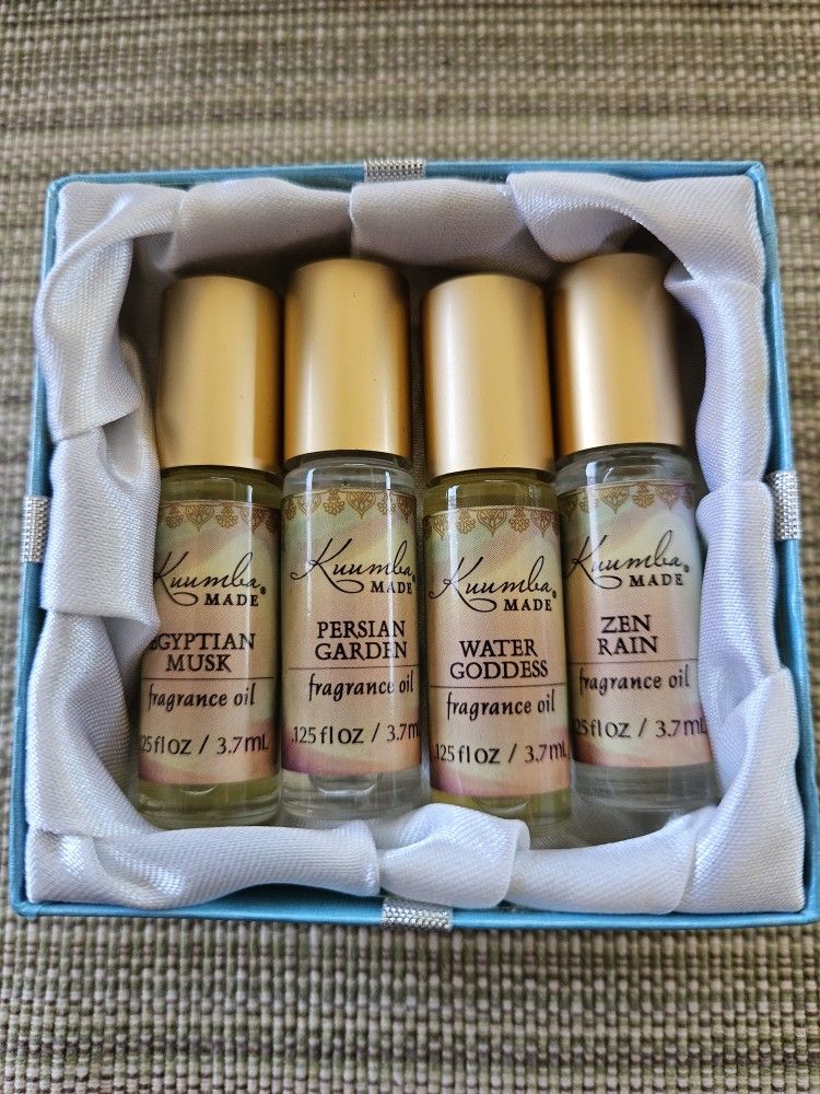 Four Bottles of Roll-Top Fragrance Oils