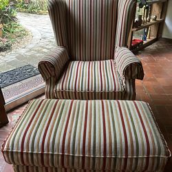 Accent armed chair and matting ottoman.