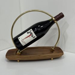 Unique Golden Bottle Carrier with a wooden base with golden legs