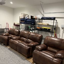 Gallery Furniture’s Powered Leather Loveseat & Two Recliners