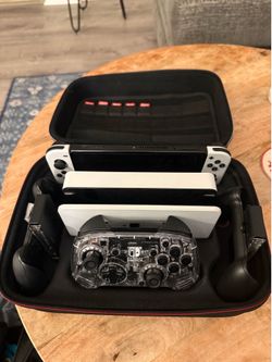Nintendo Switch W/Travel Bag, Games, and Wireless controller.