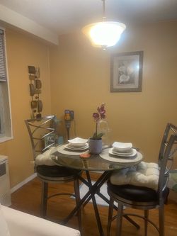 Dining table glass top metal legs 2 solid chairs