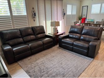 Ashley USB leatherette power reclining sofa and loveseat