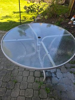 Outdoor glass and metal table