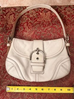 The ultimate Y2K shoulder bag! Authentic vintage Coach Soho flap bag in beautiful white leather