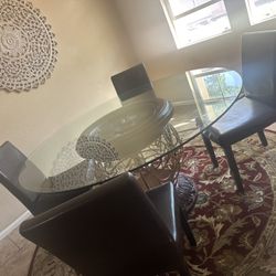 60” Glass Table And Rug With Chairs 