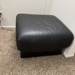 Soft ottoman on wheels.