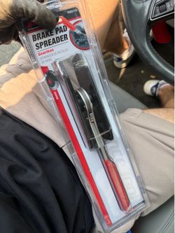 Brake pad spreader