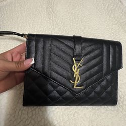 YSL CASSANDRE MATELASSÉ FLAP POUCH / WRISTLET