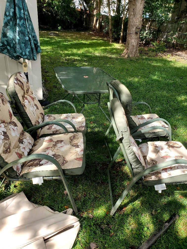 Glass Table & 4 Chairs With Cushions