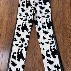 Brand new Stylish cow print pants with black leather accents. Just $12.