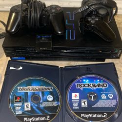 PlayStation 2 With Need For Speed And Rockband.