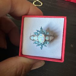 925 Sterling Silver, Opals and Genuine blue Topaz w/ Diamond accents . Tested in photos , size 7.25, marked PstarM 925, Beautiful