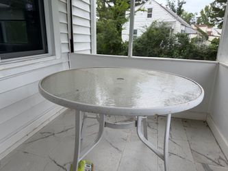Outdoor glass patio table