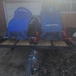 Two Snowmobiles And Tilt Trailer 