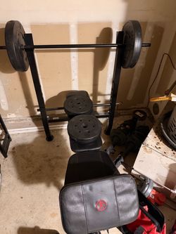 Weight Bench with Barbell and Plates