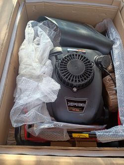 NEW lawnmower in box