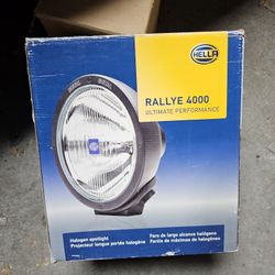 Brand new Hella Rallye 4000 foglight with cover