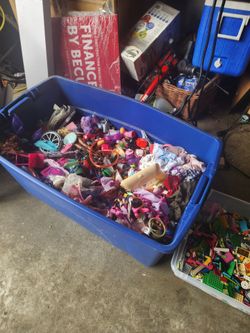 Bin of doll stuff