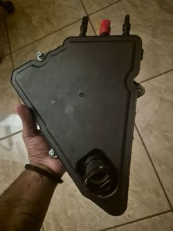 Genuine OEM GM Positive Crankcase Ventilation (PCV) Oil Separator And a coolant thermostat housing assembly
