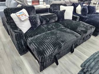 Drop Down table w/ cup holders Black corduroy sectional pullout bed
