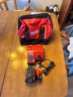 Brand new Milwaukee M12 2.0 & M18 4.0 Charger & Bag.