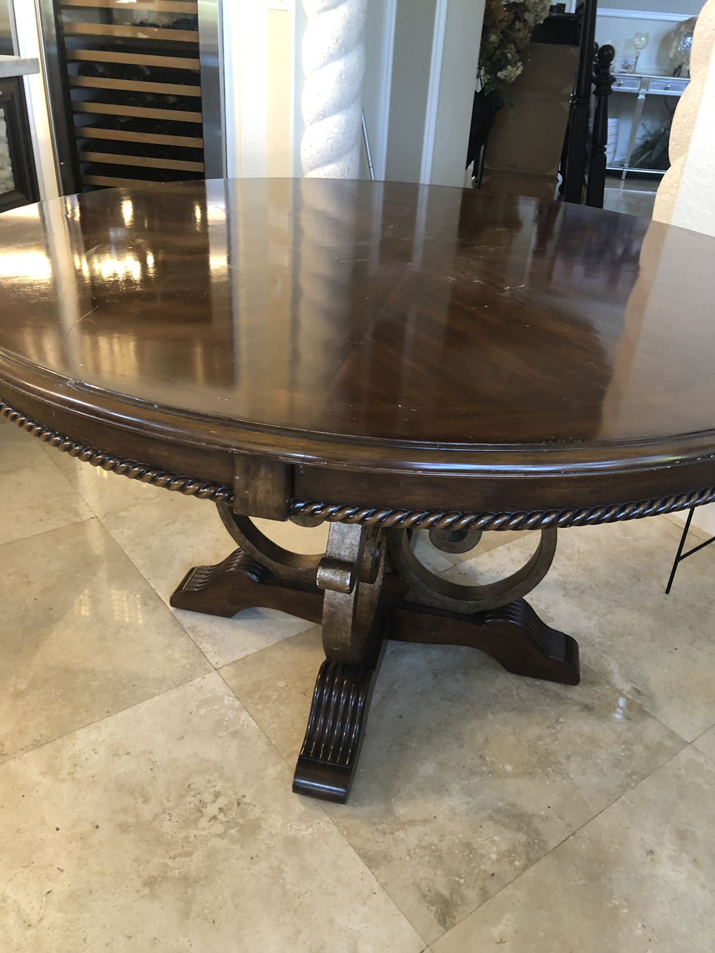 Solid wood breakfast table with brass accent and solid base. 55 diameter 30 high.