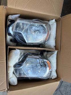 New 2015 Toyota Tacoma headlights fits 2012 to 2015 asking $175