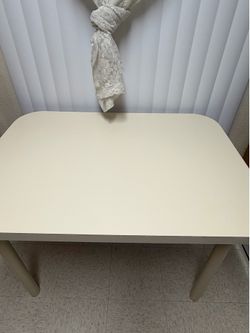 White 90s vintage 4 seat dining table only (no chairs) measures 42"L × 30"W × 30"H . Desk