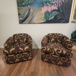 Pair of Upholstered swivel Barrel Accent Chairs