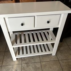 White storage table with drawers and shelves. Read description