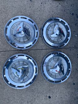 Set 4-14” 1962 Impala caps w spinners, fair condition, sell all 4 $200.00
