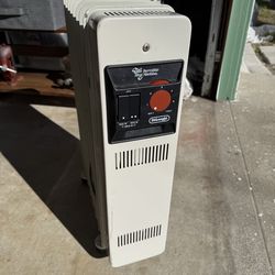 Two DeLonghi radiator space heaters. Efficient and safe. Great for that cold back room!