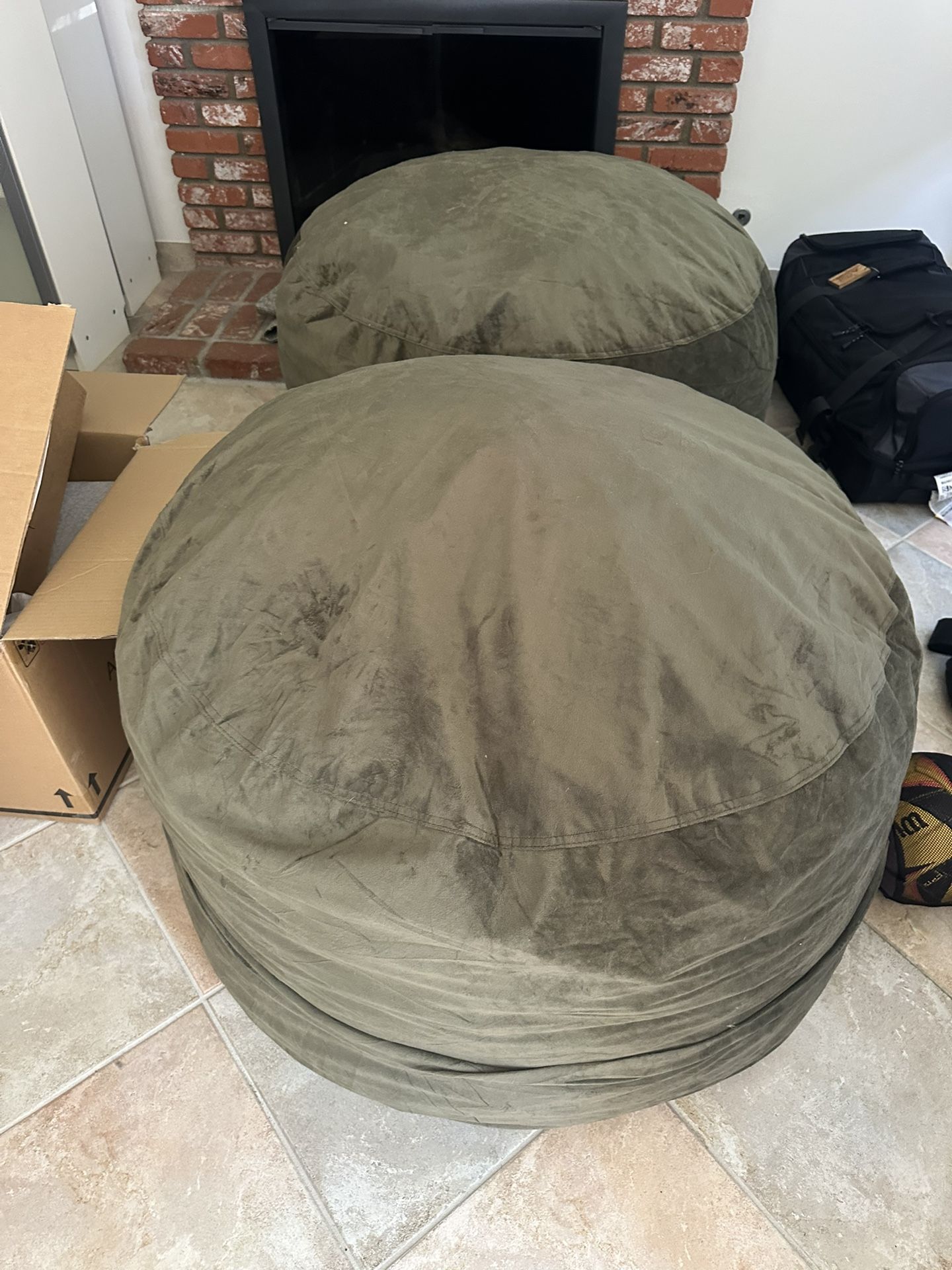 Two very lightly used beanbags. They’re filled with memory foam not beans.