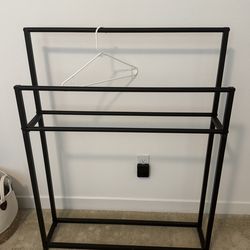 Black metal clothes drying rack towel rail