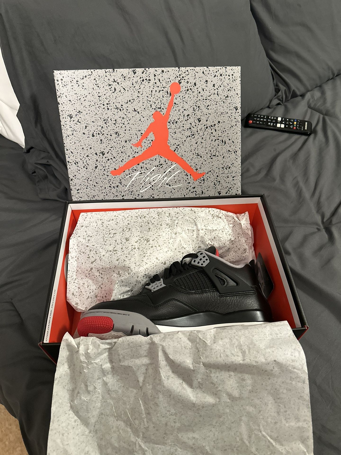 Jordan 4’s Black/Fire Red Cement Grey