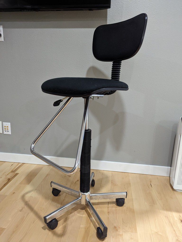 Tall drafting chair for standing desk
