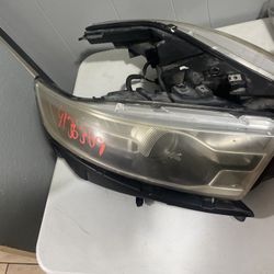 2013 Ford Taurus Front Headlights. 