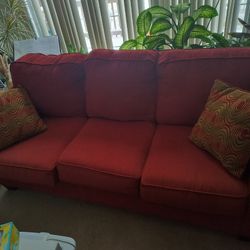 Red Cloth Couch With Pillows