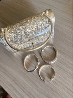 $120 Beautiful handmade handbag featuring fine metal desinhns with 3 bracalets ITS NOT SILVER